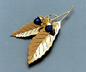 gold leaf brooch with lapis  stones